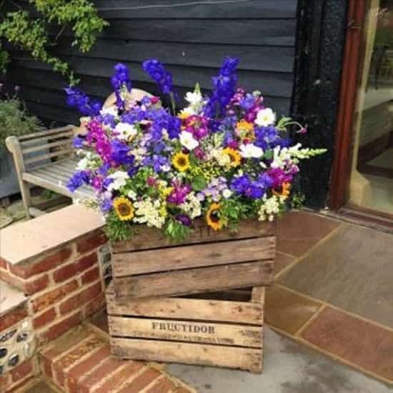 garden decoration with wooden crates 1
